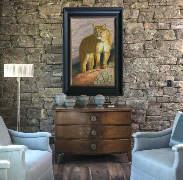 A painting of a lion on the wall in a living room.