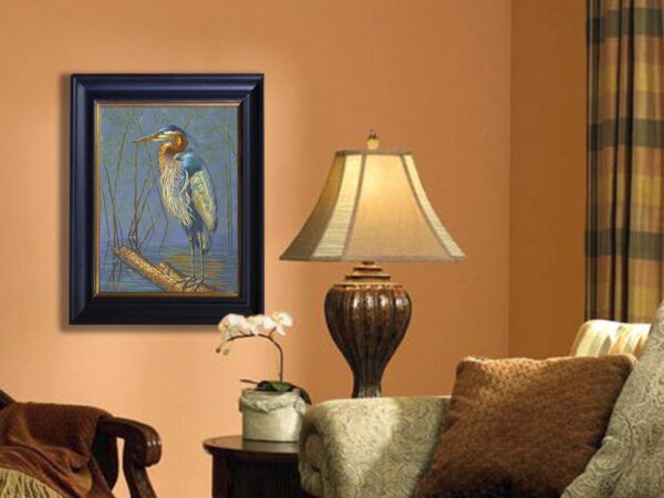 A painting of an owl is hanging on the wall.
