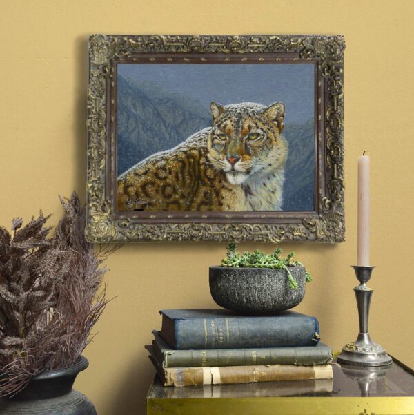 A painting of a leopard on the wall above some books