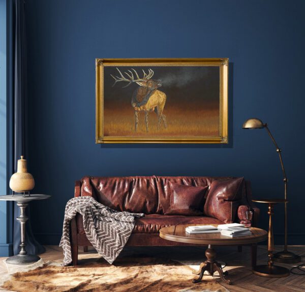 A leather couch in front of a painting.