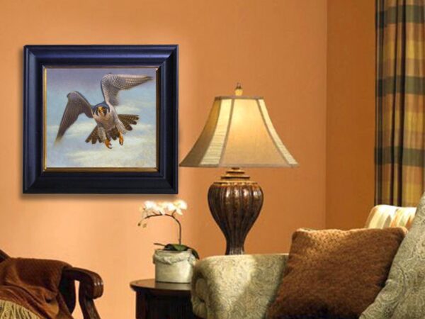 A lamp and picture on the wall in a living room.