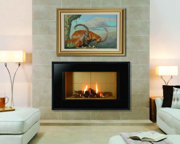 A fireplace with two paintings above it